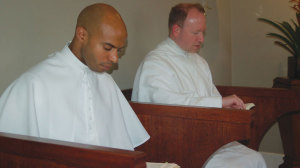 Fr. Claude (l) and a confrere at prayer